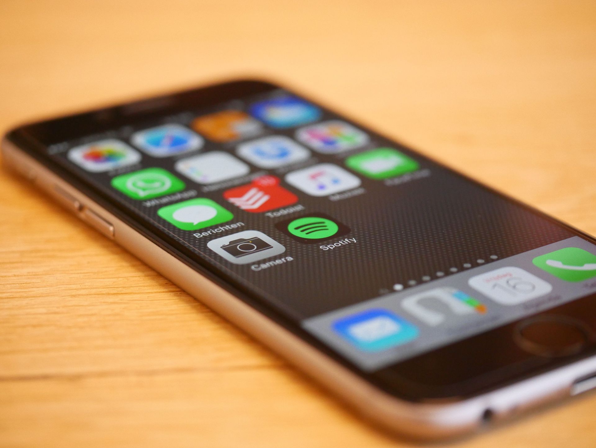 Close-up of a smartphone showcasing multiple app icons on its screen, representing modern technology and connectivity.